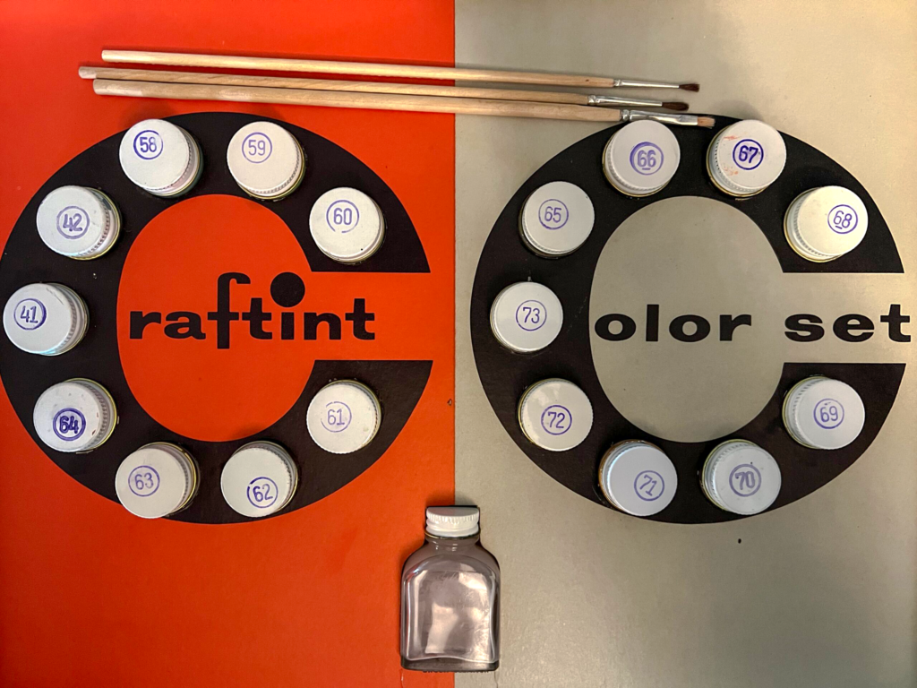 Vintage Craftint color set with labeled paint jars and artist brushes